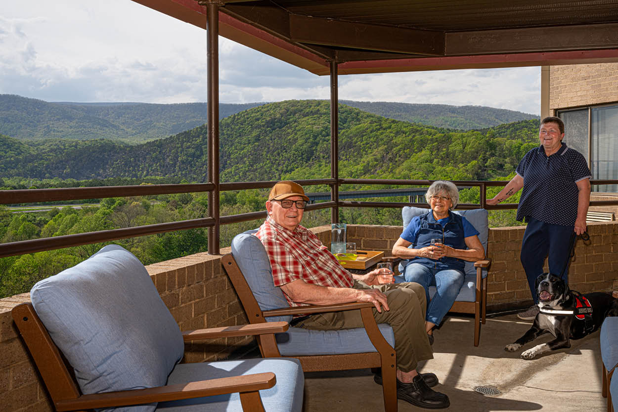 Residents enjoying the scenic views around Scott Hill from the 6th floor outdoor balcony.